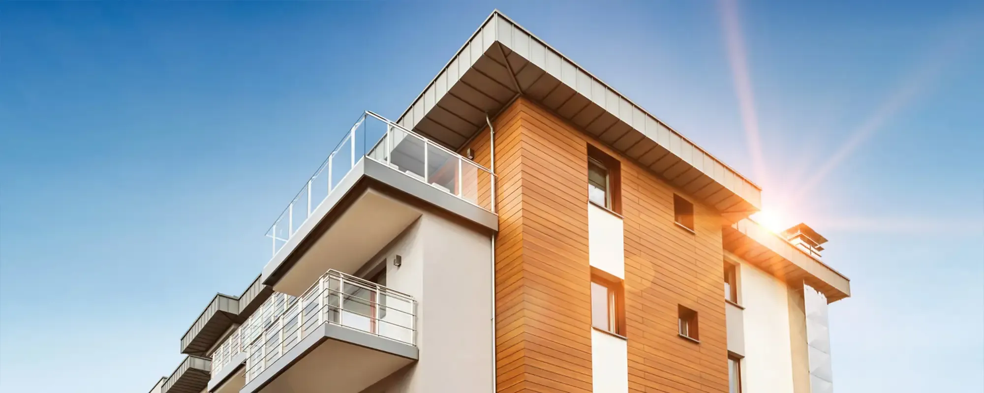 Residential build with sun shining behind
