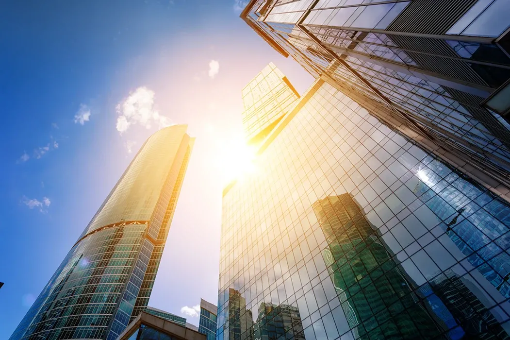 cbd building looking up with sun flare
